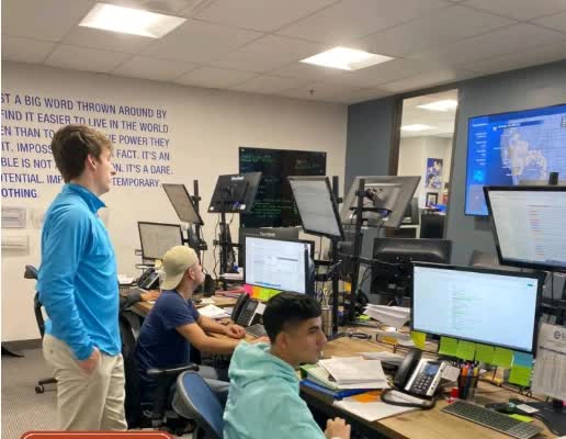 The LIVE Global Logistics dispatch floor in Dallas, with brokers working the phones and load boards